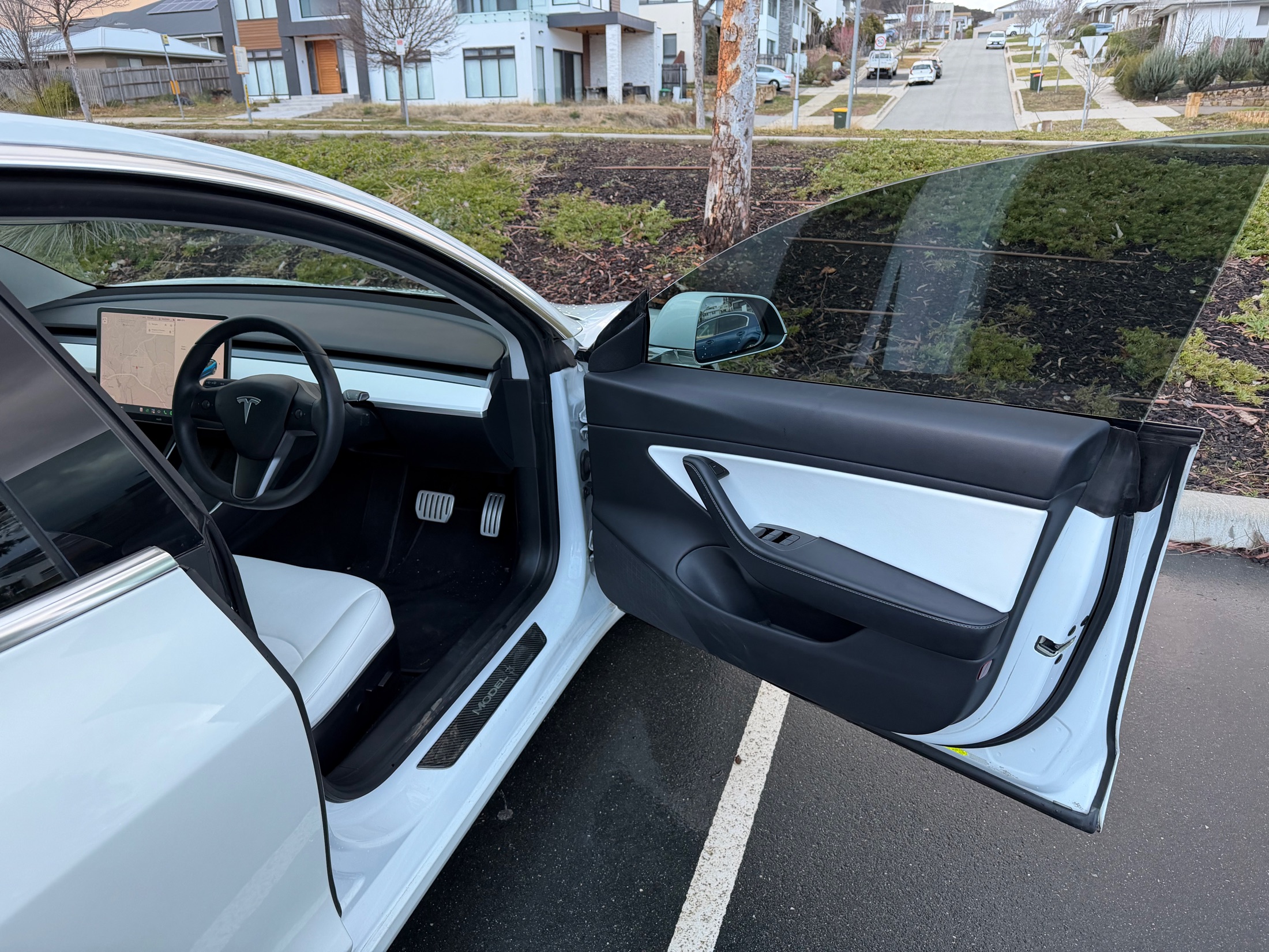 The Tesla's minimalist black and white driver's cabin